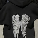Sudadera informal con estampado de alas y lentejuelas.