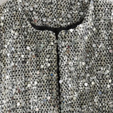 Elegante y lujosa chaqueta de tweed con lentejuelas.