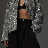 Elegante y lujosa chaqueta de tweed con lentejuelas.