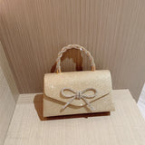 Clutch con cadena y lazo de diamantes estilo europeo y americano