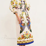 Un vestido midi informal con mangas abullonadas estampadas, exquisito y divertido, a la vez moderno.