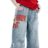 Vaqueros de pierna ancha con bordados descoloridos