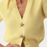 Chaleco de punto de manga corta con botones de estrella de mar