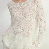 Blusa de punto jacquard con estampado de rombos