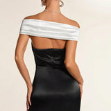 Vestido de noche blanco y negro con hombros descubiertos