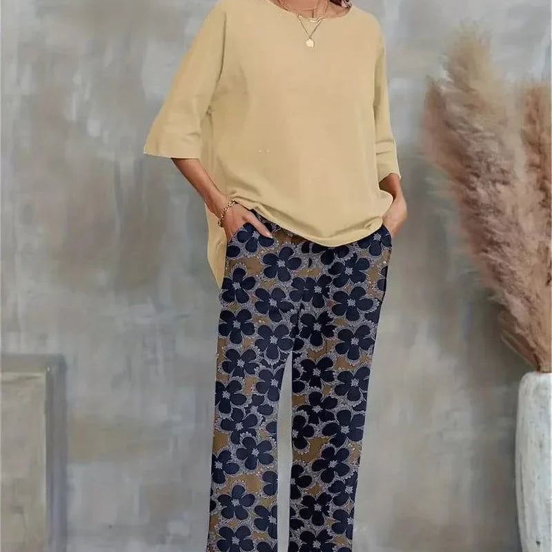 Conjunto elegante de top asimétrico y pantalón ancho con estampado floral para mujer