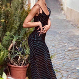 Vestido largo, transparente y con lunares, sin espalda