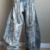 Vaqueros de pierna ancha con bordados de aguja