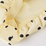 Vestido mini tulipán con espalda abierta y cinturón de lunares