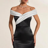 Vestido de noche blanco y negro con hombros descubiertos
