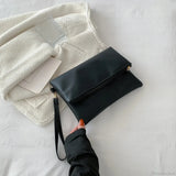 Bolso de mano tipo sobre para el Día de la Moda