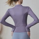 Chaqueta de manga larga elegante y ajustada para yoga, pilates y running.