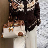 Cárdigan retro de punto holgado con cuello jacquard y botones de cuerno.
