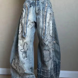 Vaqueros de pierna ancha con bordados de aguja