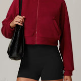 Chaqueta deportiva de yoga de polar con cuello alto y cremallera.