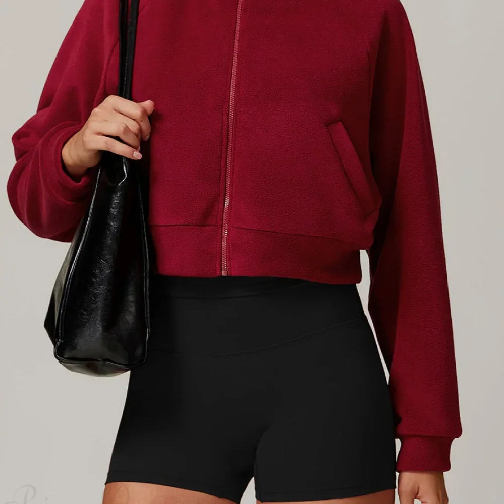 Chaqueta deportiva de yoga de polar con cuello alto y cremallera.