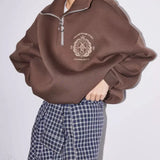 Sudadera de cuello alto, media cremallera y forro polar con letras bordadas