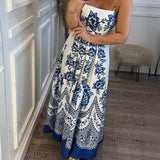 Elegante vestido midi holgado con fruncido en la espalda y estampado de flores étnicas.