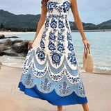 Elegante vestido midi holgado con fruncido en la espalda y estampado de flores étnicas.