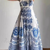 Elegante vestido midi holgado con fruncido en la espalda y estampado de flores étnicas.