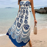 Elegante vestido midi holgado con fruncido en la espalda y estampado de flores étnicas.