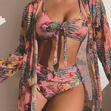 Conjunto de dos piezas con manga larga y lazo floral en la parte delantera.