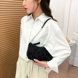 Bolso de hombro con asa y estampado floral