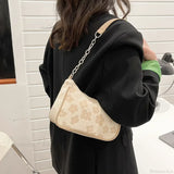 Bolso de hombro con asa y estampado floral
