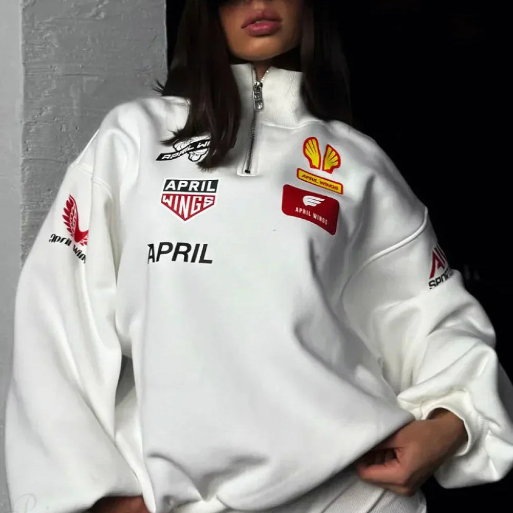 Sudadera holgada con cuello alto y estampado de motociclista, media cremallera.