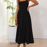Elegante vestido midi negro con cuello halter y cintura baja