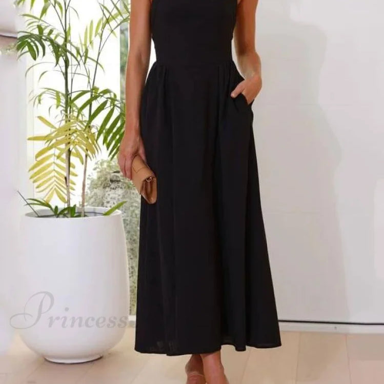 Elegante vestido midi negro con cuello halter y cintura baja