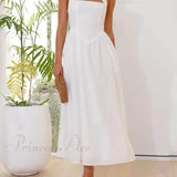 Elegante vestido midi negro con cuello halter y cintura baja