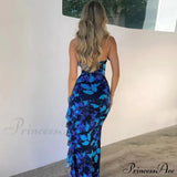 Vestido midi de moda con espalda abierta, volantes, detalles de cordones y abertura estampada.