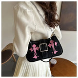 Bolso de hombro de lona con hebilla de metal