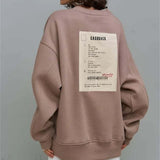Sudadera oversize con cuello redondo y estampado con etiquetas gruesas de canalé.