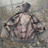 Sudadera con capucha de hip-hop con aplicación de ojo en la costura superior.