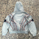 Sudadera con capucha de hip-hop con aplicación de ojo en la costura superior.