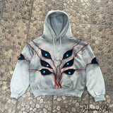 Sudadera con capucha de hip-hop con aplicación de ojo en la costura superior.
