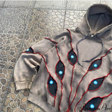 Sudadera con capucha de hip-hop con aplicación de ojo en la costura superior.