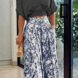 Conjunto de dos piezas para mujer: Top holgado con mangas murciélago y pantalones anchos de cintura alta.