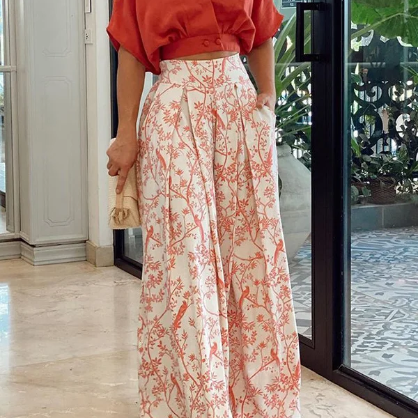 Conjunto de dos piezas para mujer: Top holgado con mangas murciélago y pantalones anchos de cintura alta.