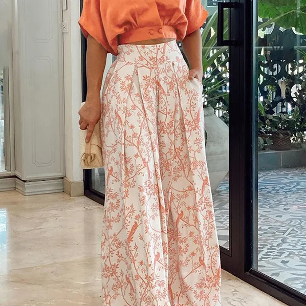 Conjunto de dos piezas para mujer: Top holgado con mangas murciélago y pantalones anchos de cintura alta.