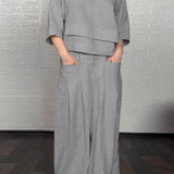 Conjunto informal para mujer: Top holgado con cuello en V, pantalones anchos de cintura alta y lino y algodón.