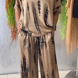 Conjunto de traje para mujer: satén suave, corte holgado, cuello redondo, pantalón ancho estampado.