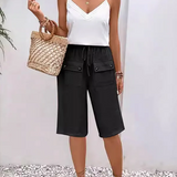 Pantalones de mujer – Corte holgado – Largo hasta la rodilla – Cintura con cordón – Tejido transpirable