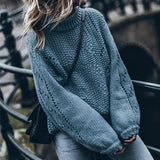 Suéter de mujer – Punto grueso – Corte oversize – Cuello alto – Mangas caladas
