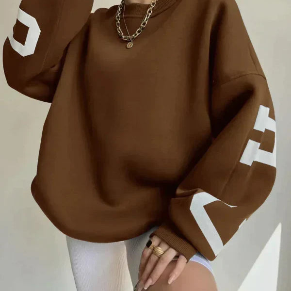 Sudadera de mujer – Corte oversize – Algodón suave – Hombros caídos – Estampado en la manga