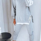 Conjunto de ropa de estar por casa para mujer: sudadera de cuello redondo extragrande y pantalones deportivos ajustados. Mezcla de algodón transpirable.