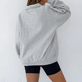 Sudadera holgada con mangas farol y cuello polo.