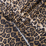 Vestido corto con estampado de leopardo, escote en pico y lazos cruzados
